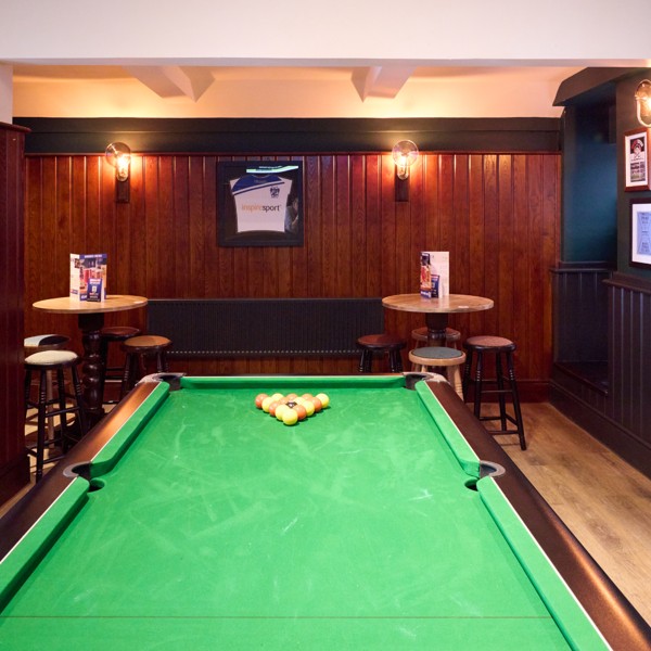 Pool table area providing casual entertainment for guests throughout the week.