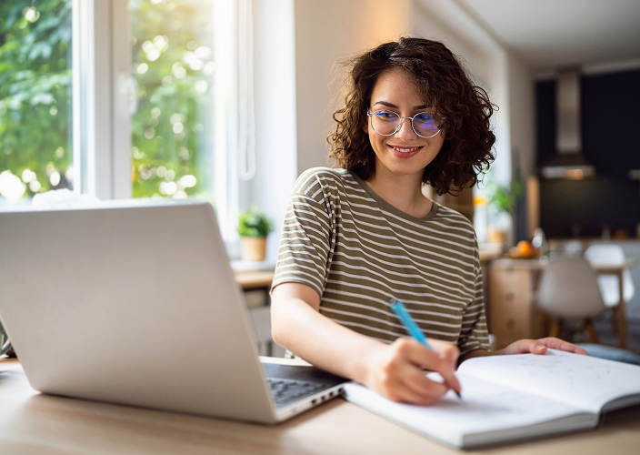 A client taking a financial literacy course on their laptop.
