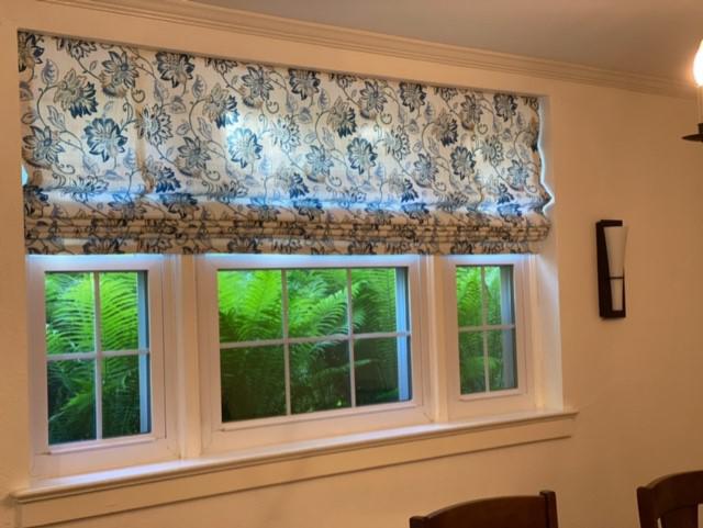 Add a bit of flair to your living room with our specially designed Roman Shades that come in various shades and patterns like this beautiful flower design we installed in Pleasantville.