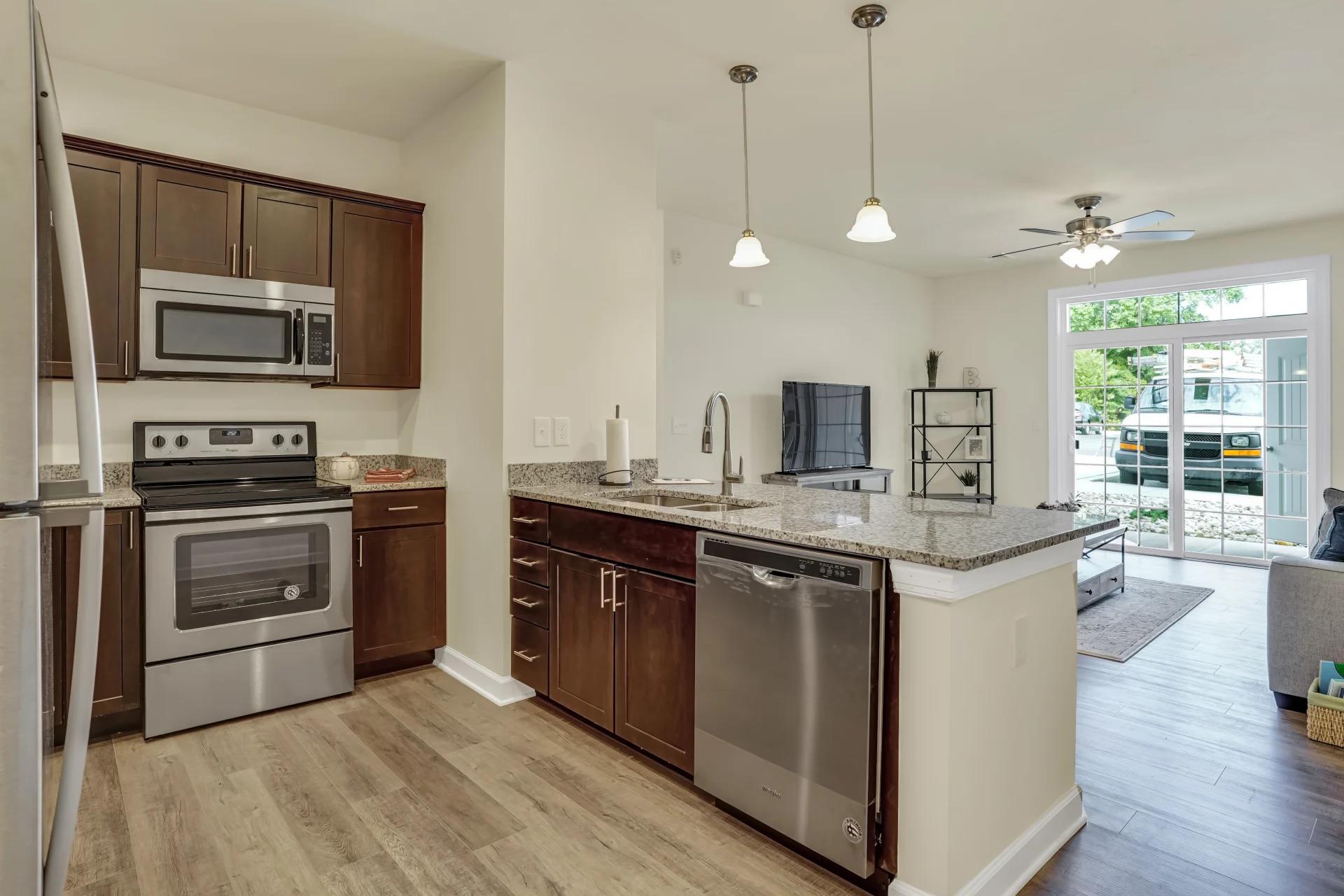 Fully Equipped Kitchen with Stainless Steel Appliances at Rowen Place