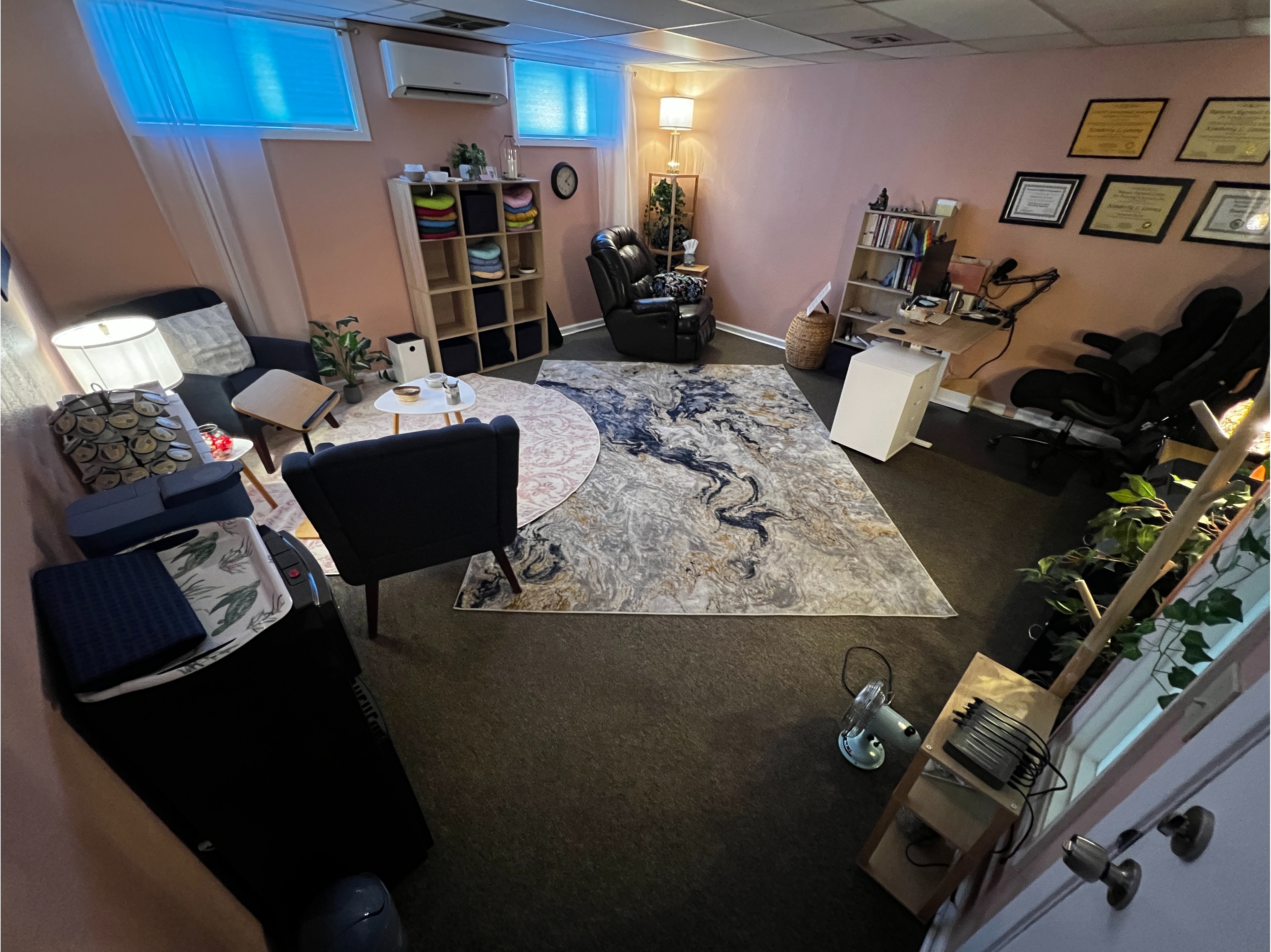 Main Office Overview:  Warm and welcoming hypnosis and coaching office interior designed to create a calm, safe, and empowering environment for personal transformation, emotional healing, and mindset coaching sessions.