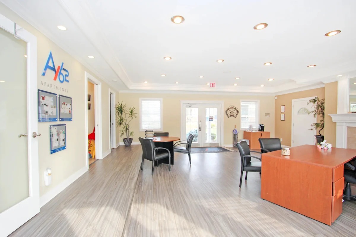 A reception area with a desk and chairs