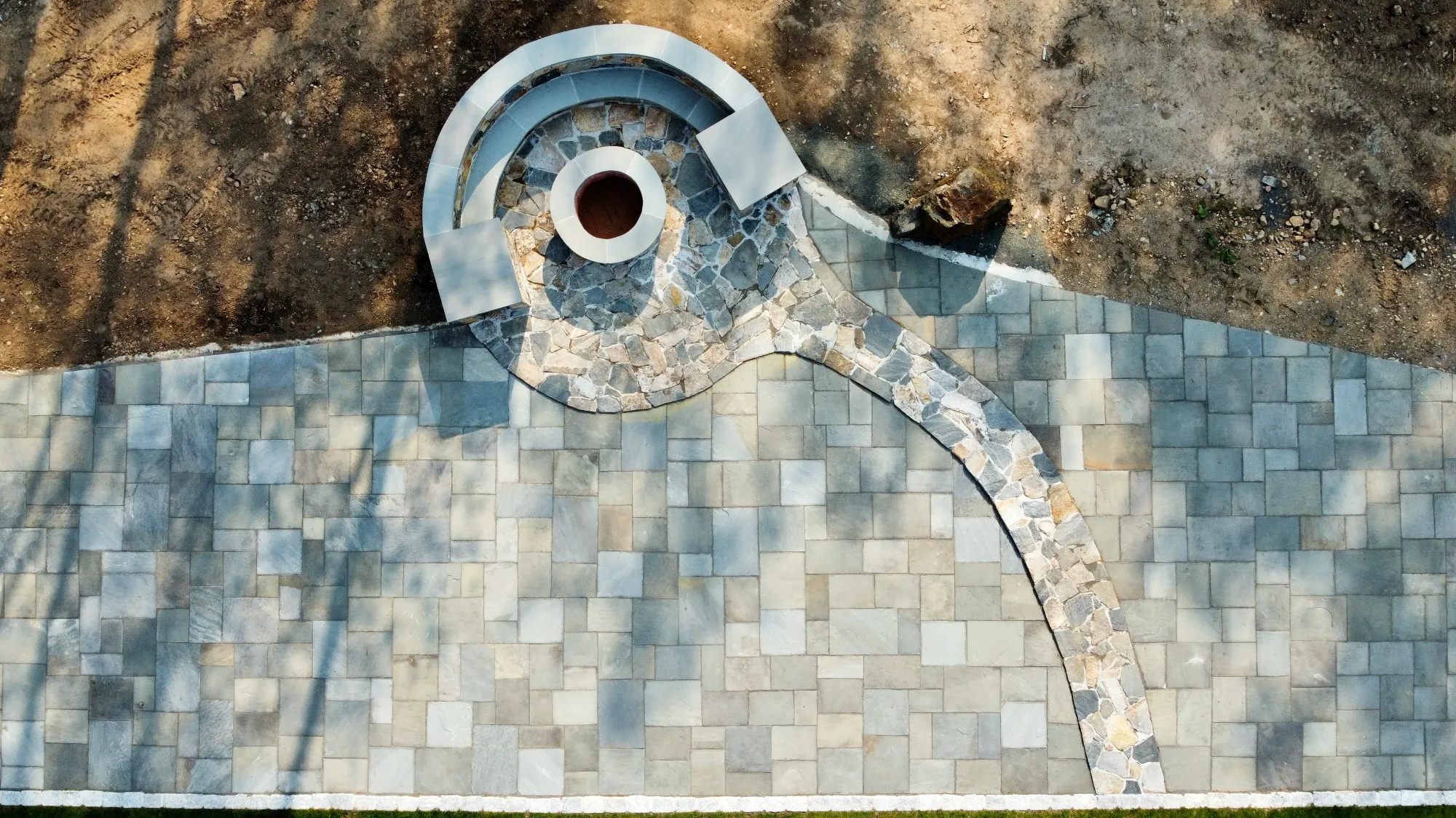 Aerial view of a paver patio and backyard hardscape - Patios project by General Masonry LLC.