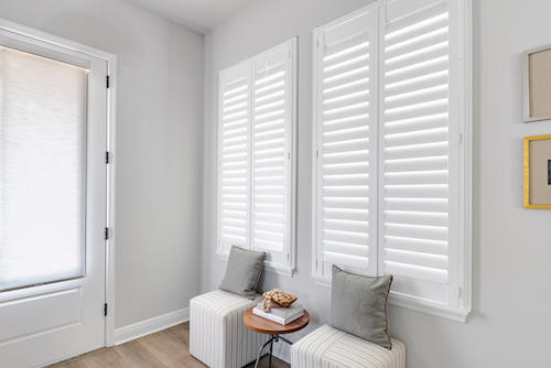 Shutters serve as a natural filter in this quaint reading nook,  diffusing the sunlight just enough to create a calming atmosphere. Wood shutters elevate any room, and are easy to operate with their cordless design!