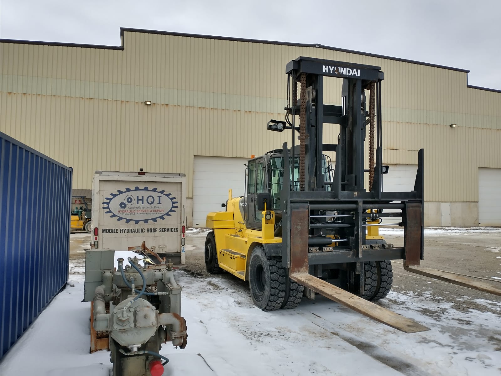 Mobile Repair Service Working On a Forklift