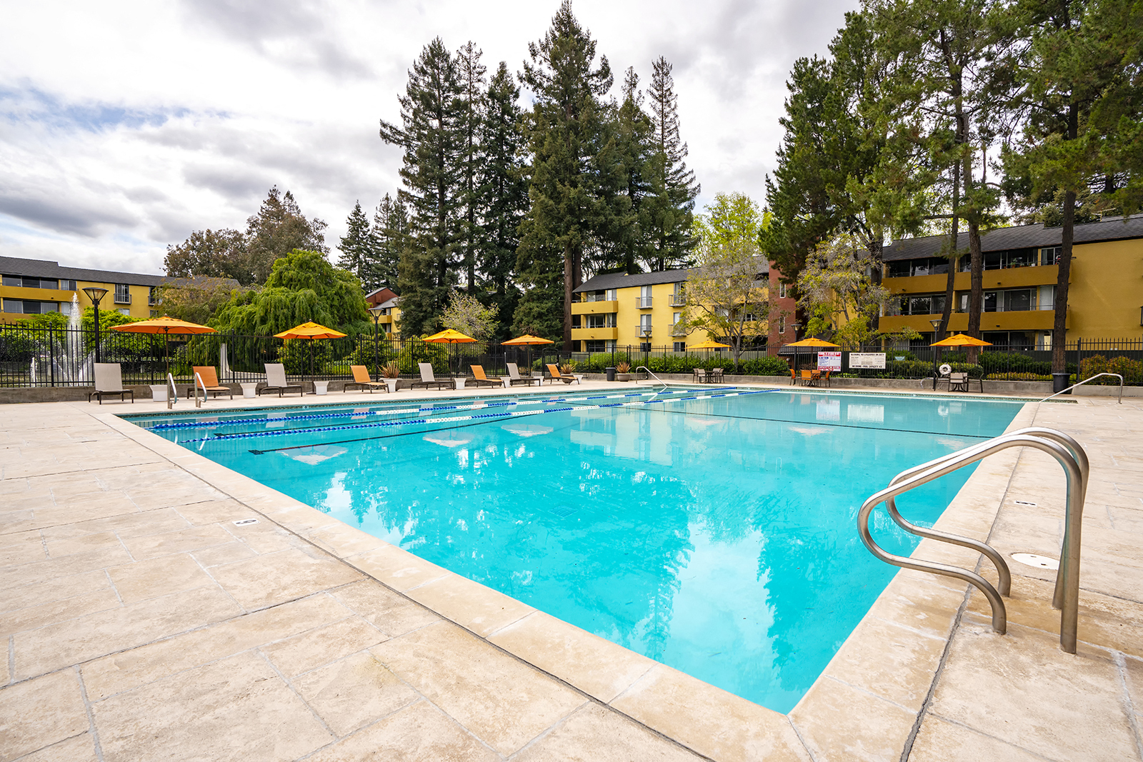 Outdoor pool area with lounge chairs