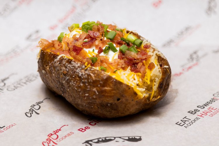 Bacon, shredded cheddar, sour cream, green onions, & margarine.