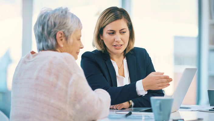 A portfolio manager assisting her client.
