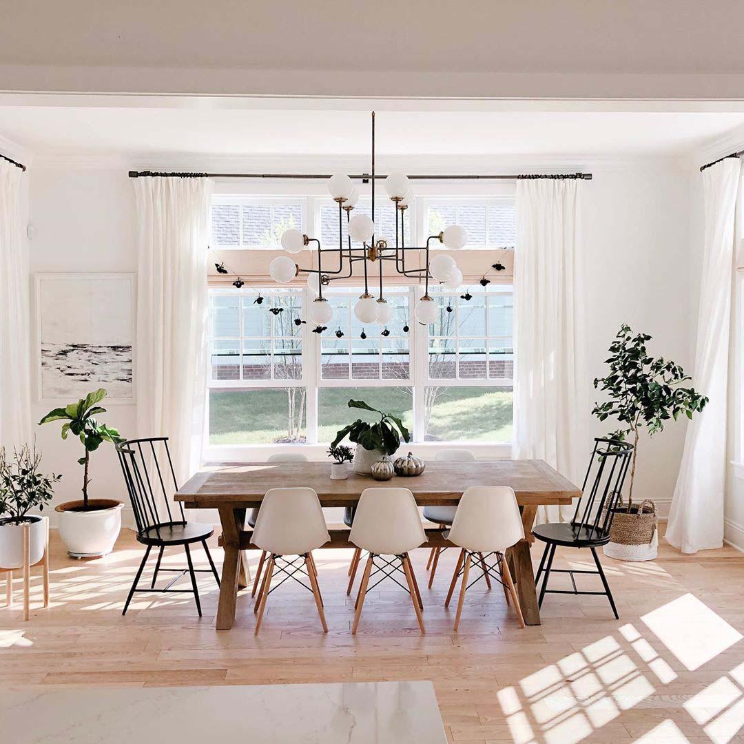 Drapery paired with woven wood shades makes your dining room look elegant. Budget Blinds of New Westminster & Surrey Port Coquitlam (604)359-9655