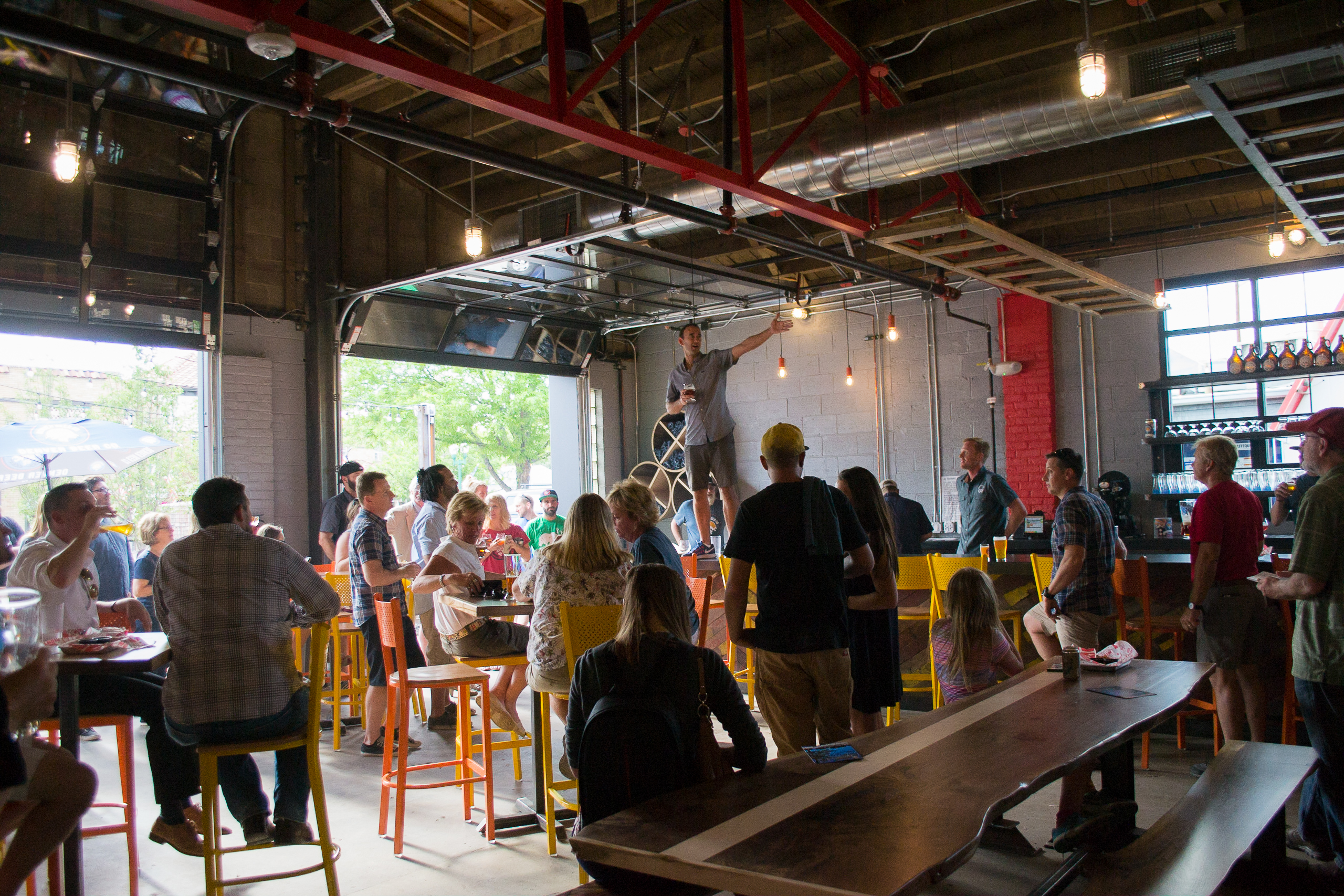 Friends and families gather inside Denver Beer Co. Olde Town Arvada to enjoy craft beer, community events, and a welcoming neighborhood atmosphere.