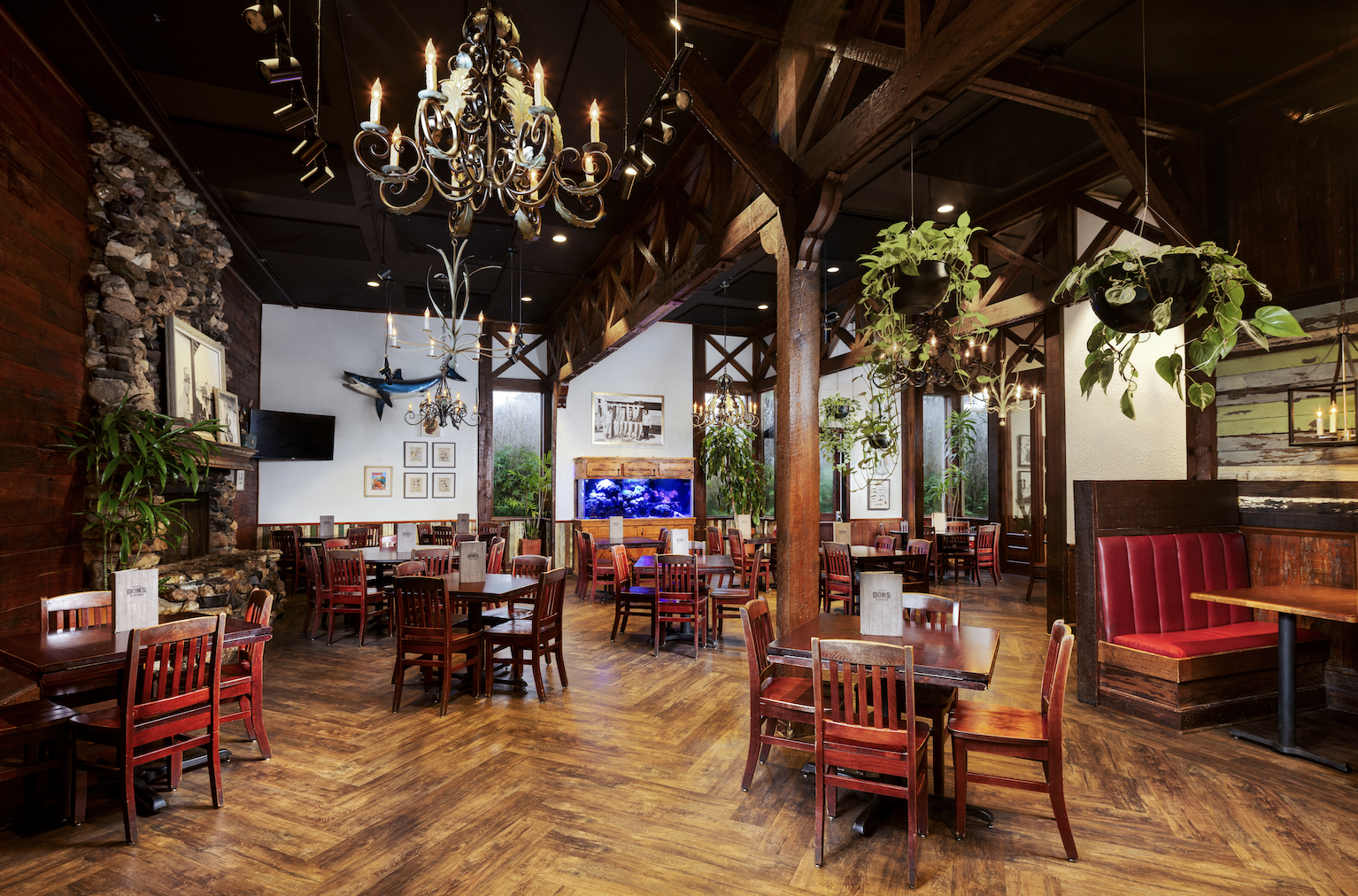 Lafayette's main dining room blends rustic wood trusses and wrought-iron chandeliers with a cozy sto 