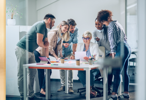 People gathered around a boardroom table.