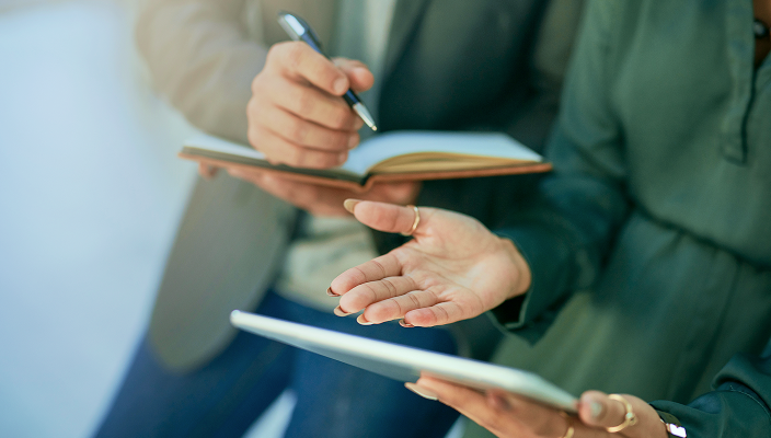 A couple reviewing their annual report.