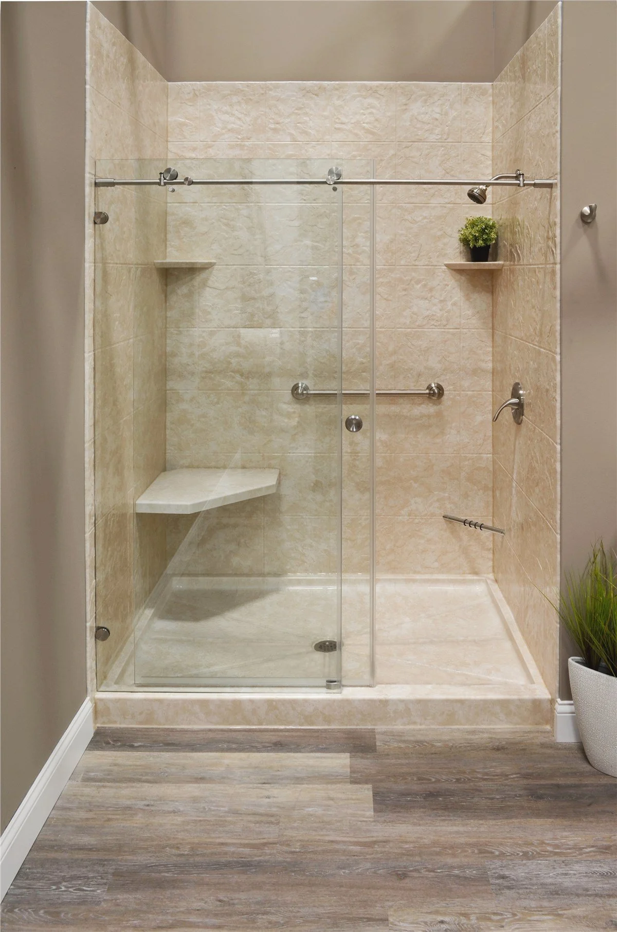 Accessible walk-in shower with glass enclosure and built-in seat in Portland, Maine