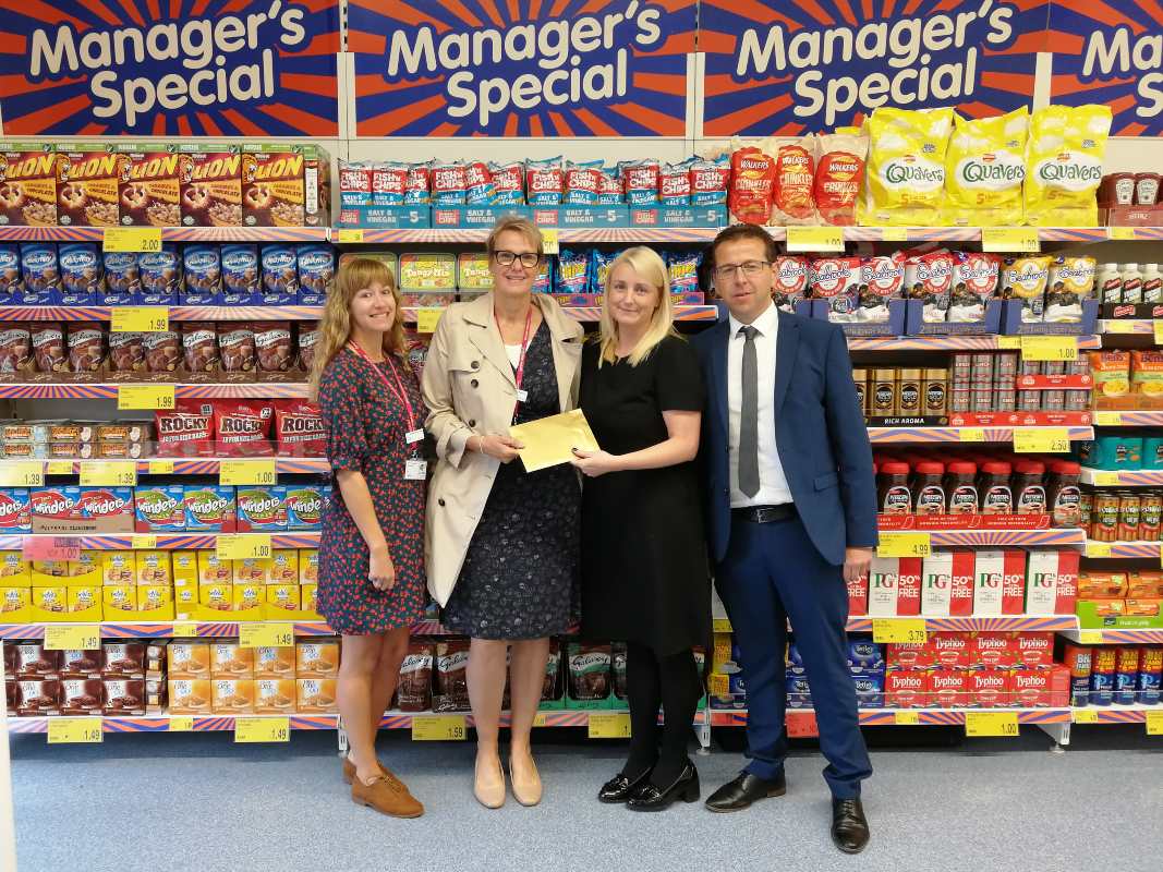 Store staff at B&M's newly re-fitted store in Blackpool (Vicarage Lane) present their nominated local charity with £250 worth of B&M vouchers.
