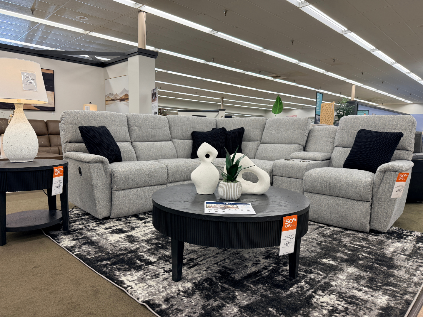 Mattress gallery inside Slumberland Furniture Burlington in Burlington, Iowa with mattresses available to try in the showroom.