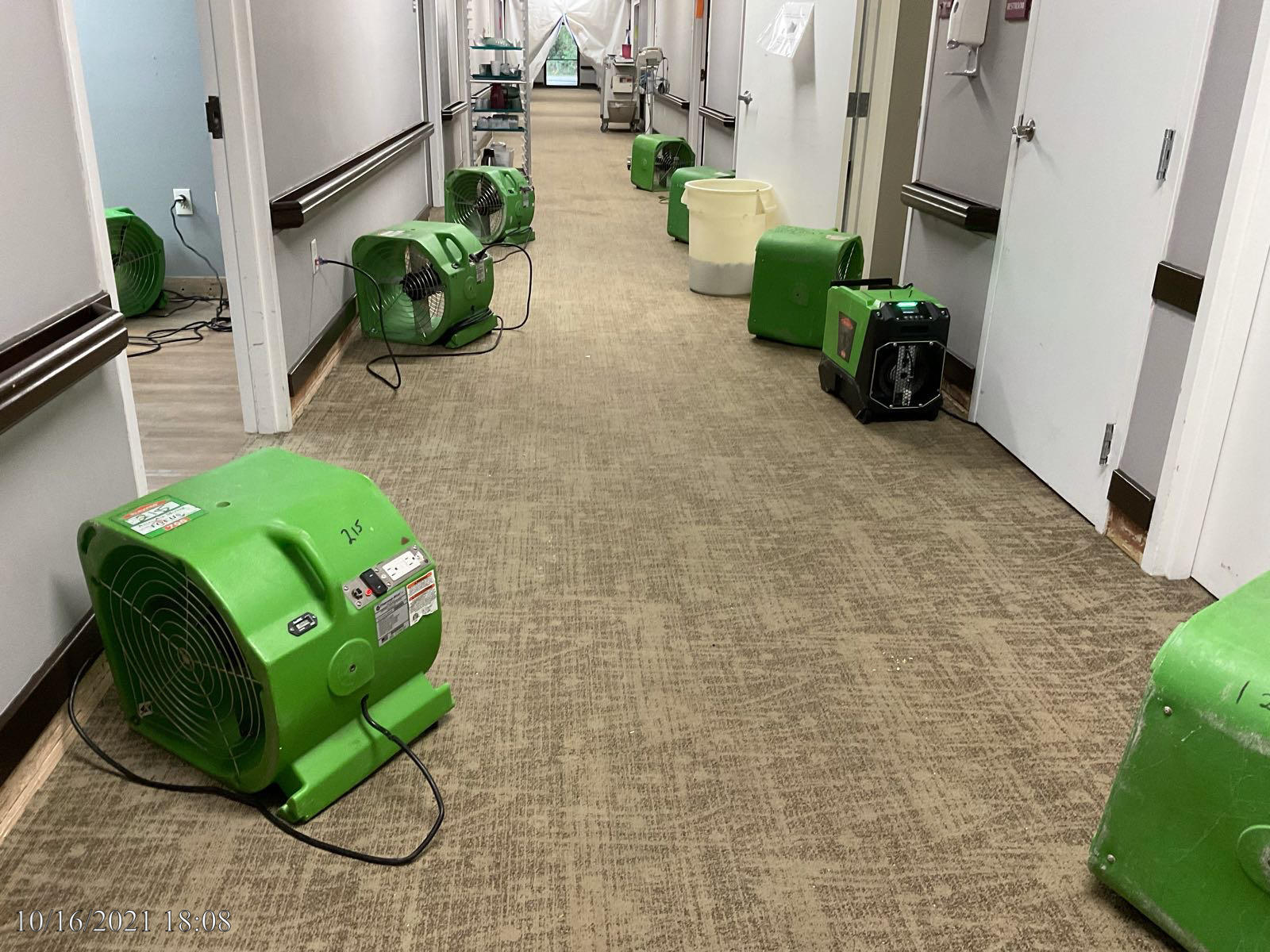 SERVPRO equipment in a hallway at a commercial building in Akron, Ohio.