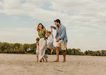 A family walking on the beach.