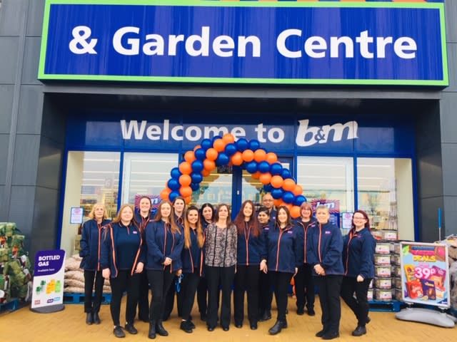 Store staff at B&M's new store in Leighton Buzzard (located at Grovebury Retail Park) pose in front of the purpose built B&M Home Store & Garden Centre.