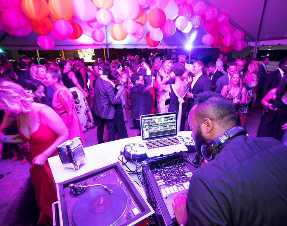 Guests dancing during a lively private event at The Glass Factory in Jacksonville.