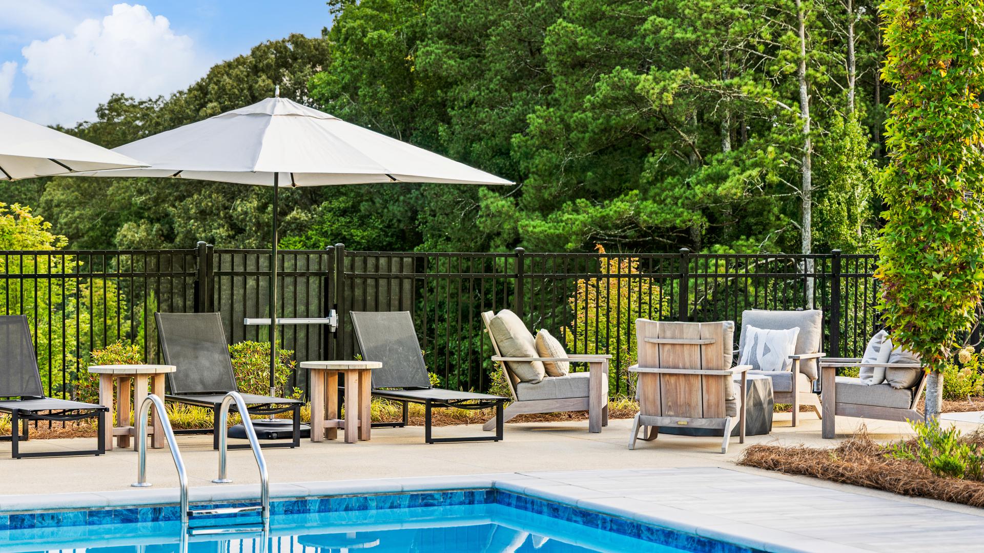 Sun-splashed pool with lounge seating