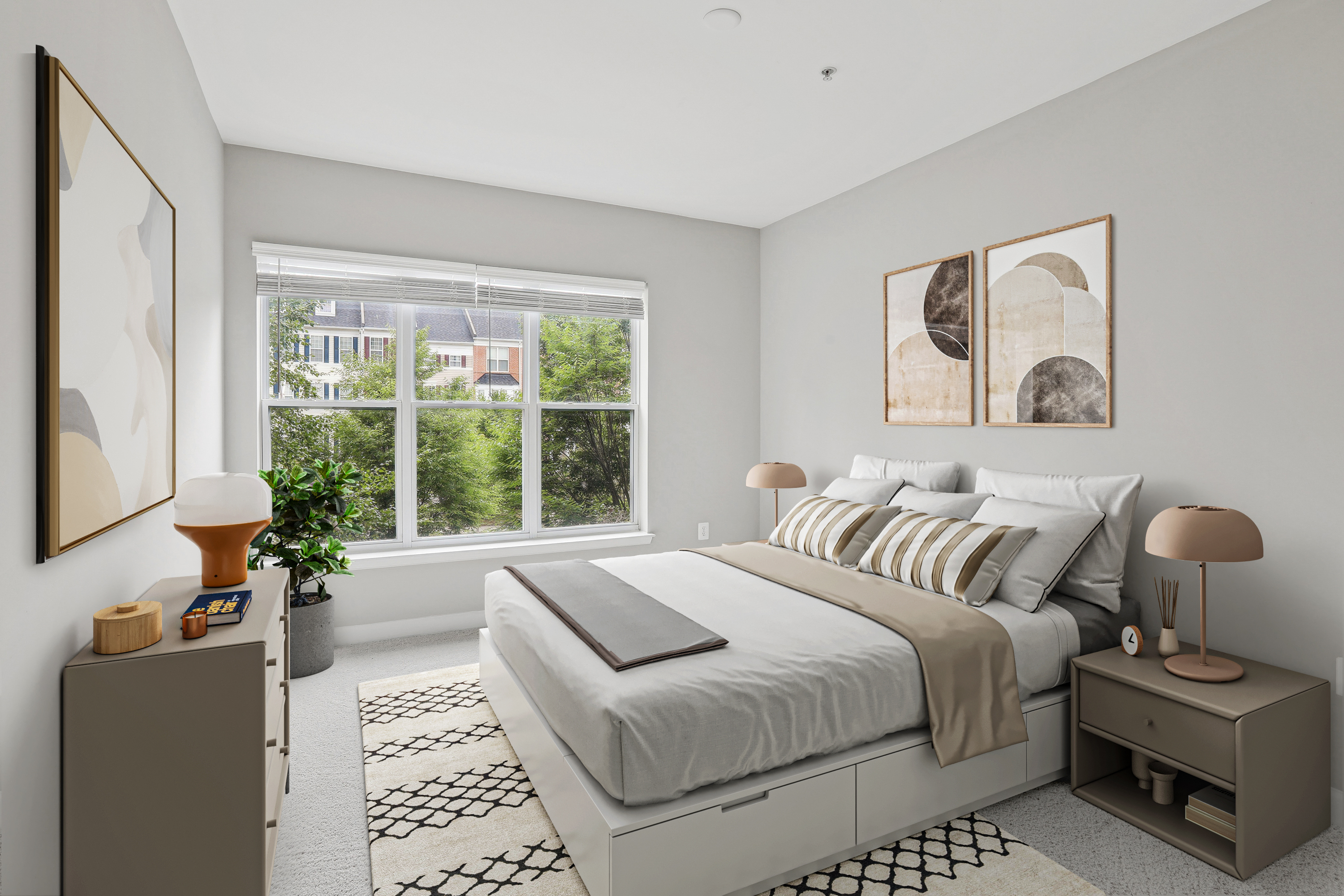 A bedroom with a large bed, a window with a view, and a painting on the wall.