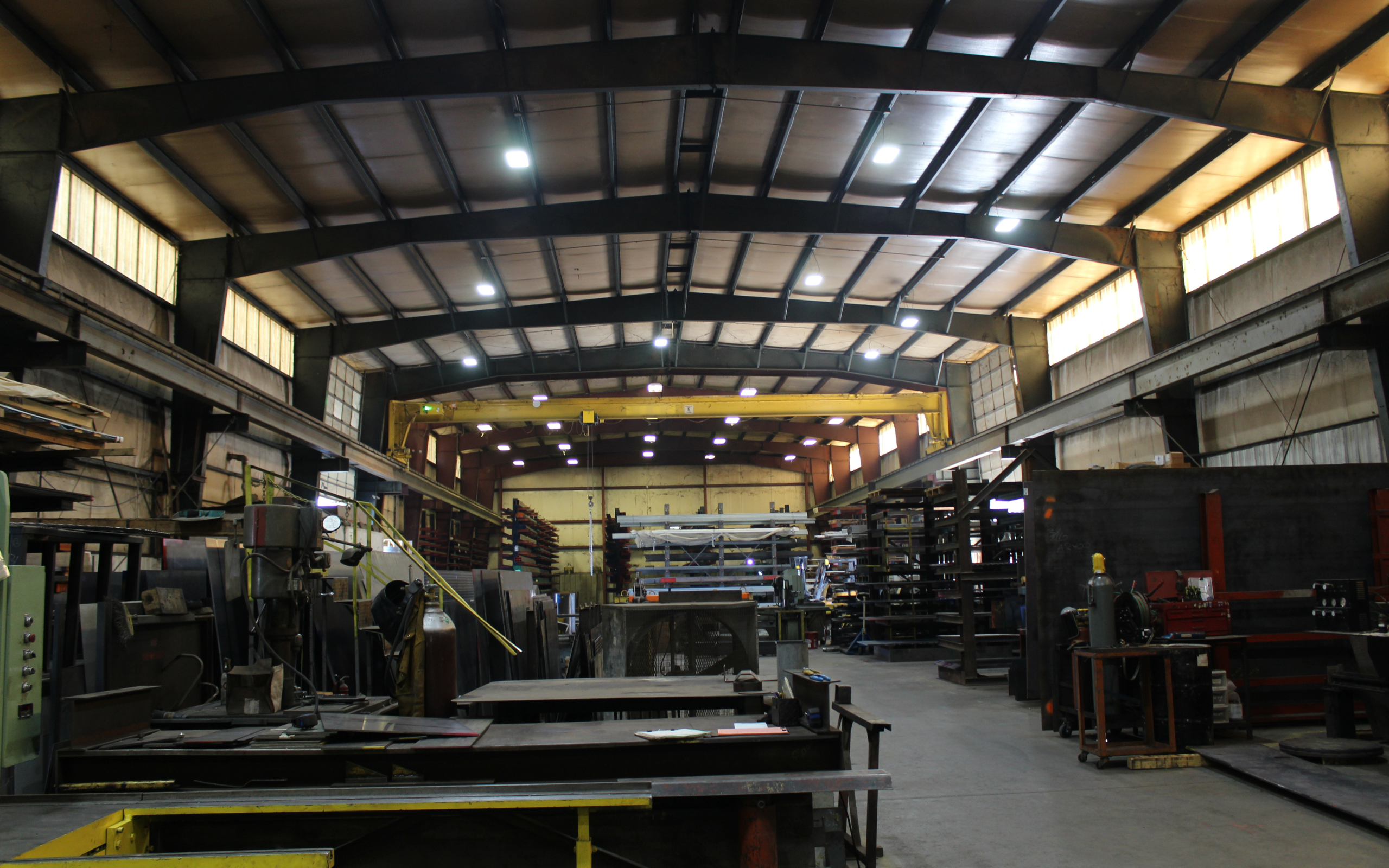 Inside Ozark Mountain Steel’s fabrication facility, where custom steel components and structural materials are built in-house. Our shop is equipped to handle large-scale steel fabrication projects for commercial, agricultural, and residential construction.