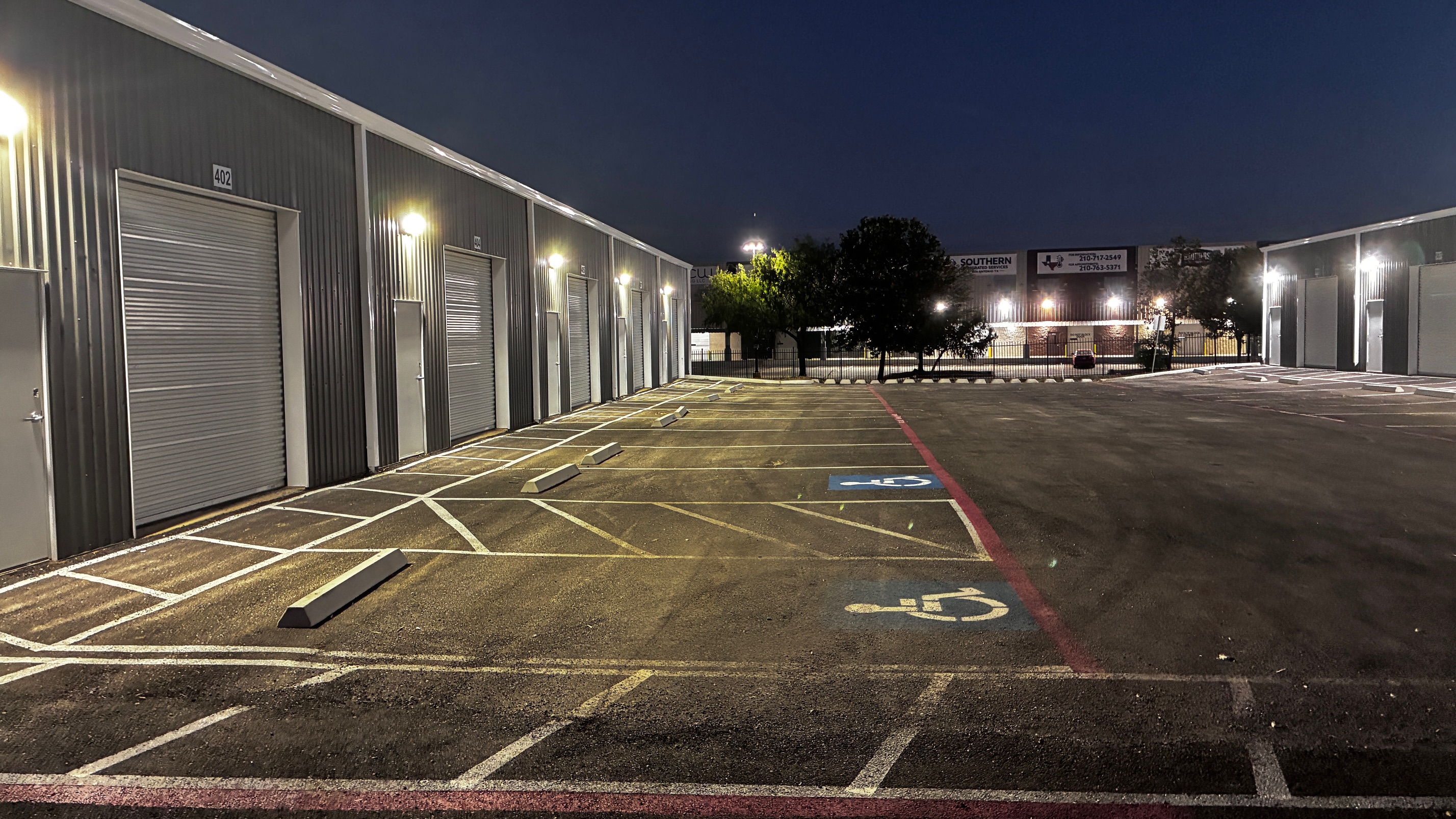 Engineered commercial storage development featuring accessible parking, durable pavement design, and 