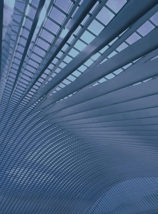 The ceiling of a modern building with windows and streamlined panels that mimic RBC's energy lines.