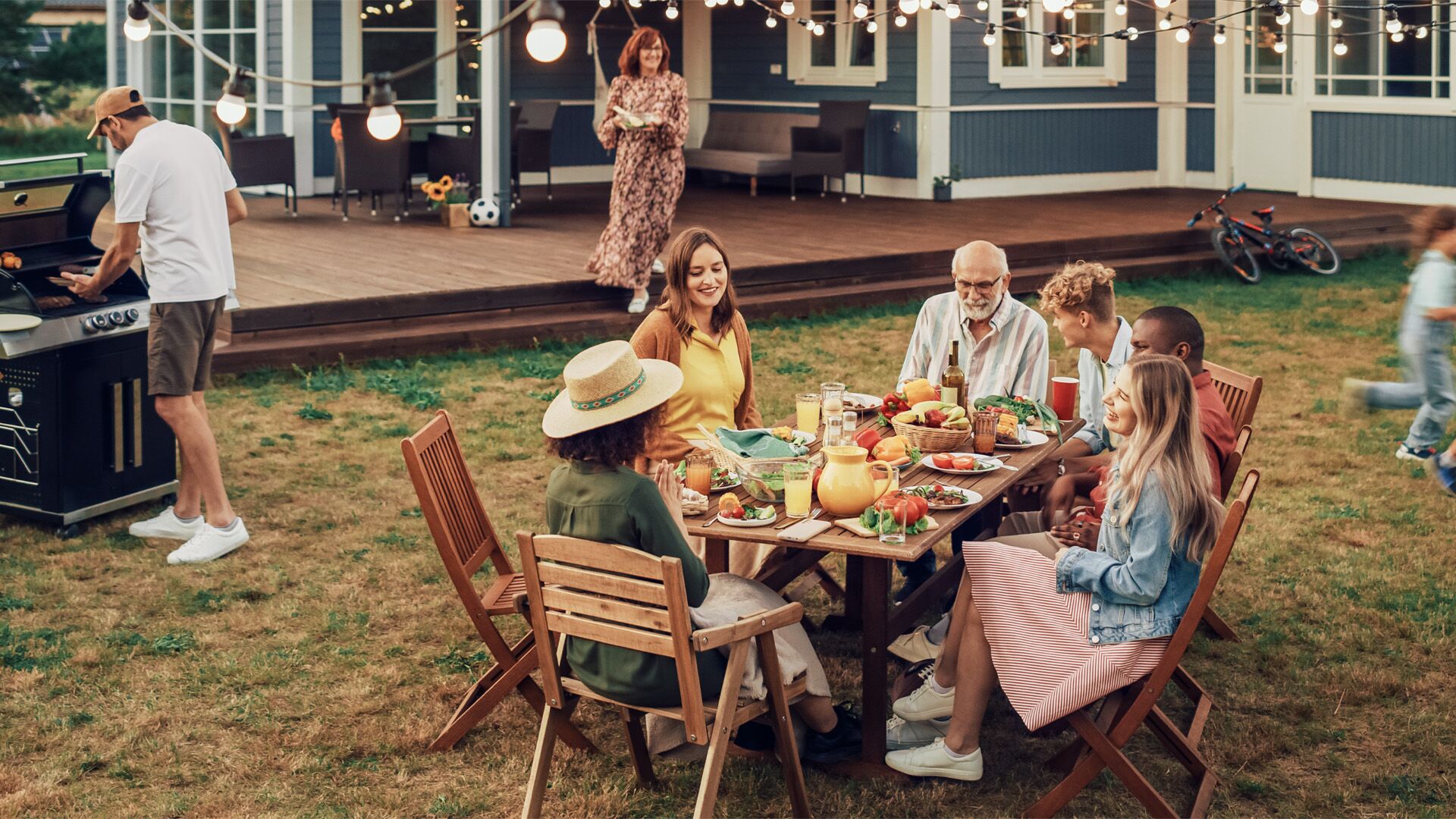 A caucasian family enjoying a cookout.