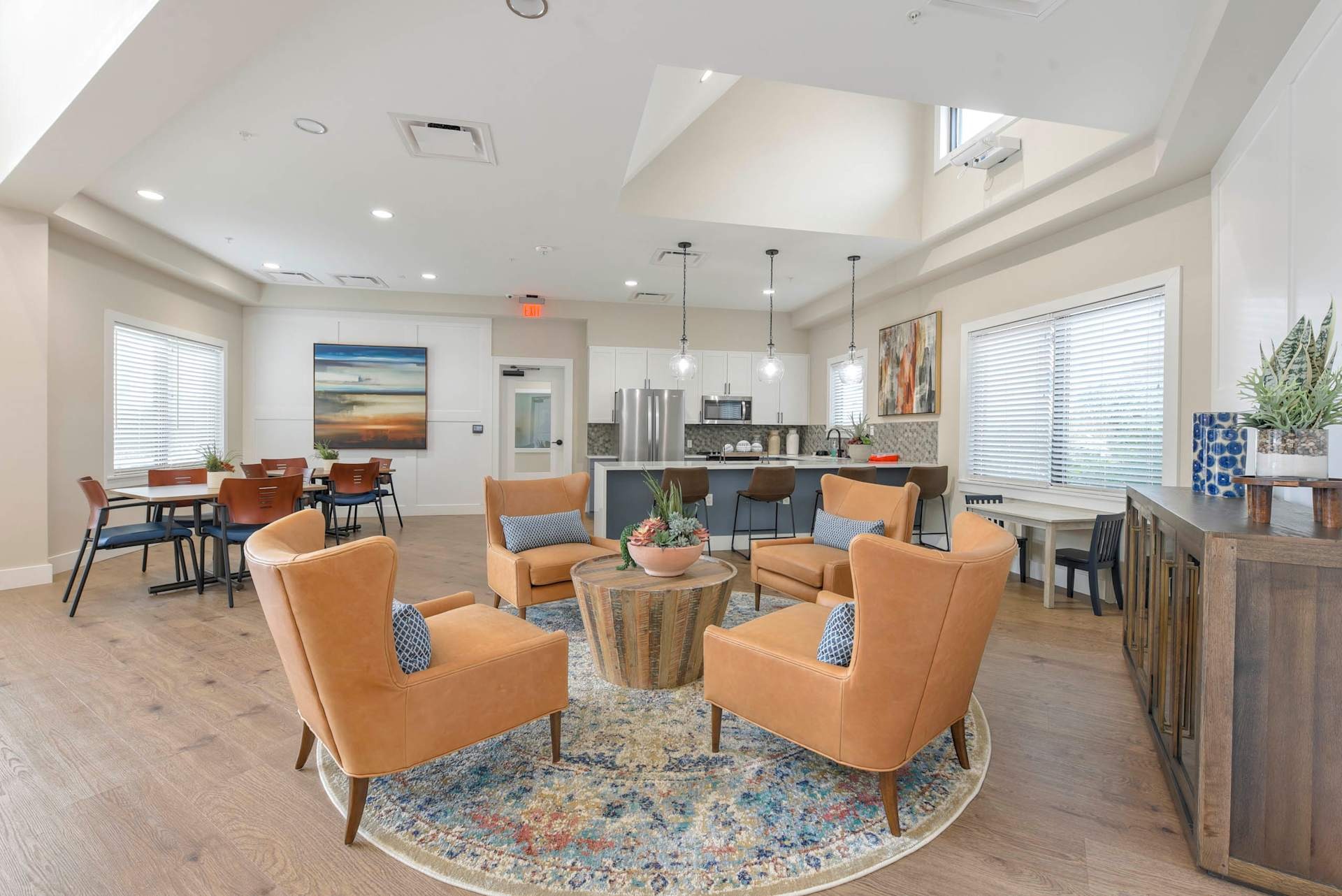 Community clubhouse with orange chairs.