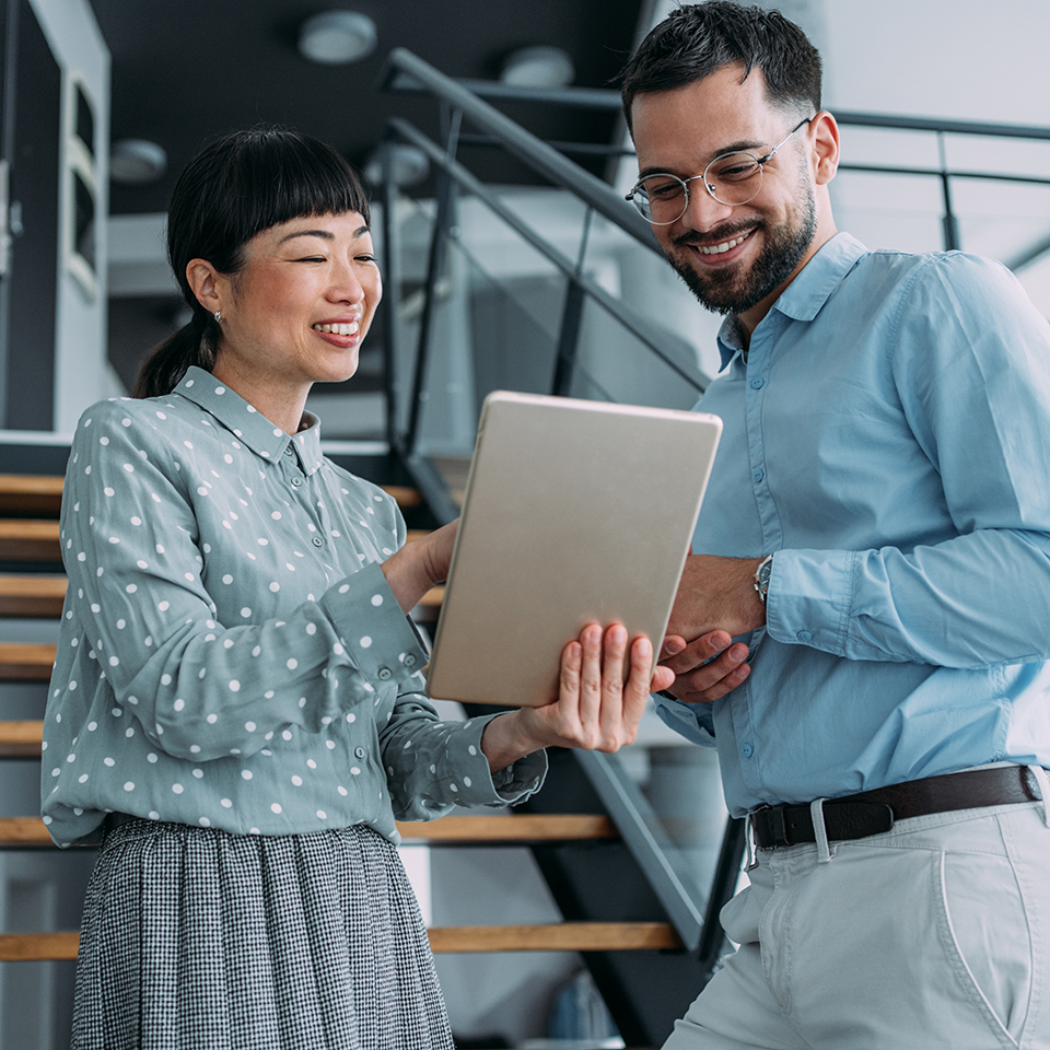 Two business people looking at a tablet