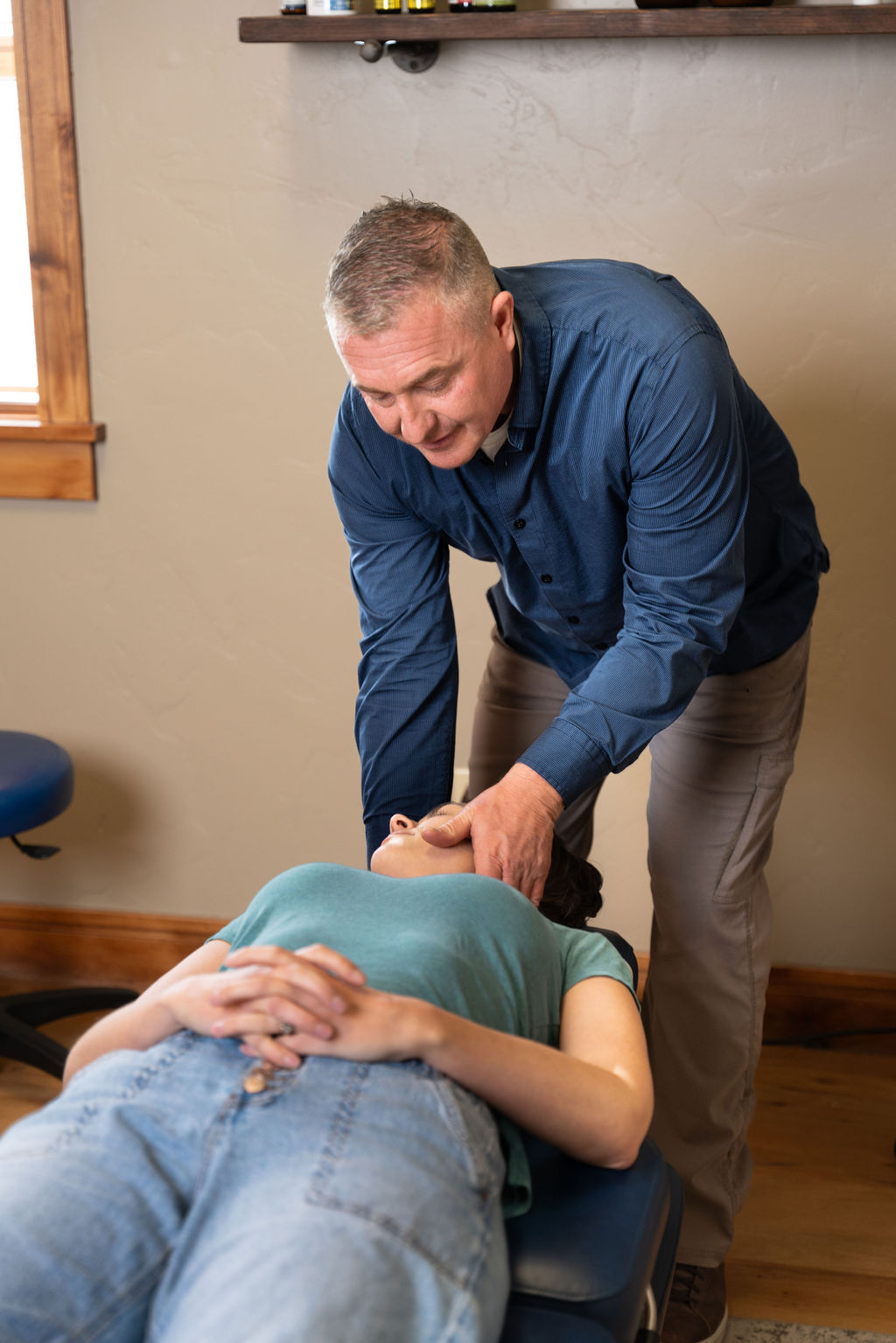 Chiropractor in Logan helping a patient