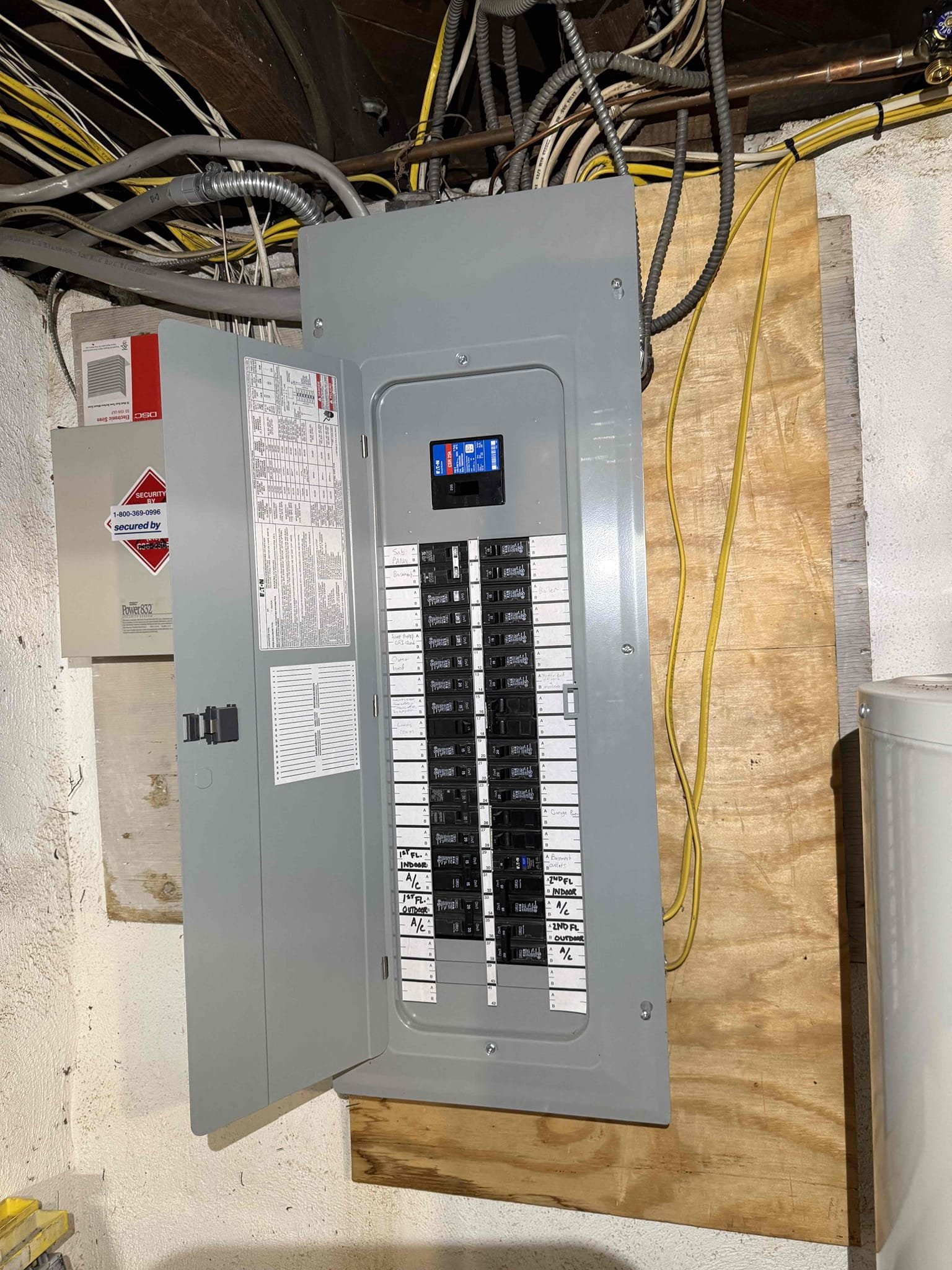 A fully labeled Eaton breaker panel installed by Thomas Edison Electric in a Bryn Mawr, PA basement. Every circuit is clearly identified on the directory, a hallmark of professional panel work that makes future troubleshooting easy for the homeowner.