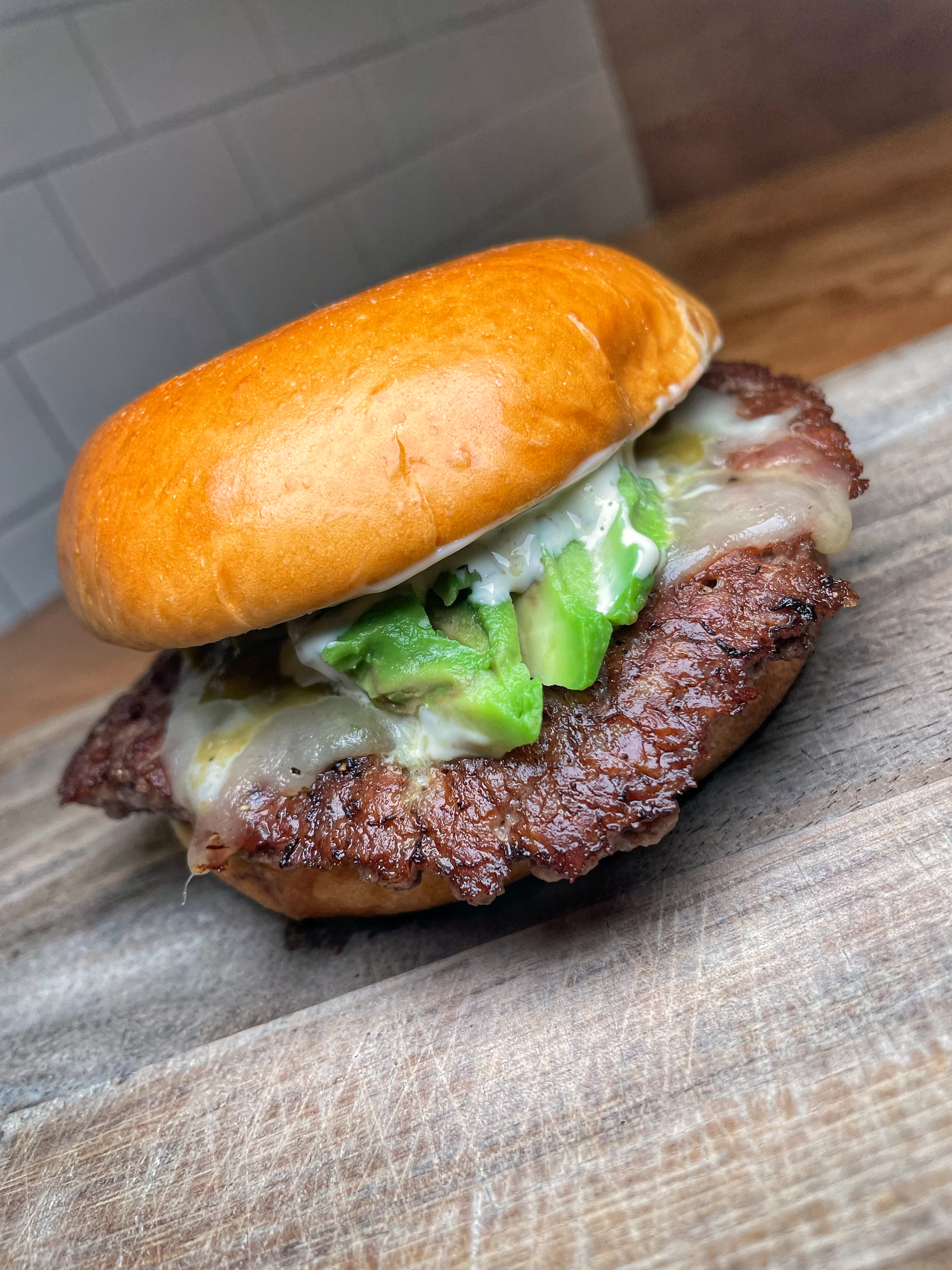 Single Certified Angus Beef Patty, House Spice Blend, Monterey Jack Cheese, Roasted Hatch Chile, Avocado, Lime Aioli, Brioche Bun