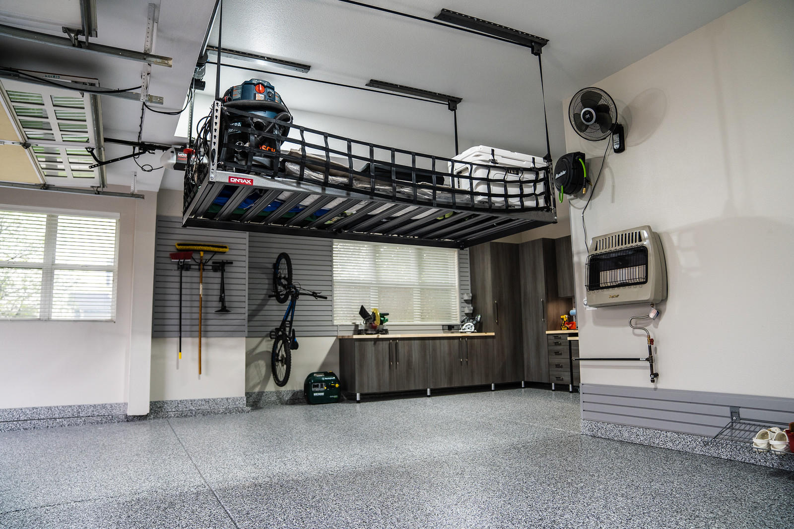 You can take advantage of all the space you have with our overhead storage options. Whether you’re getting your summer gear out of the way or need some place to store all the Christmas stuff, using the space above your head is a clever way to do it. This is especially true for small garages where sp