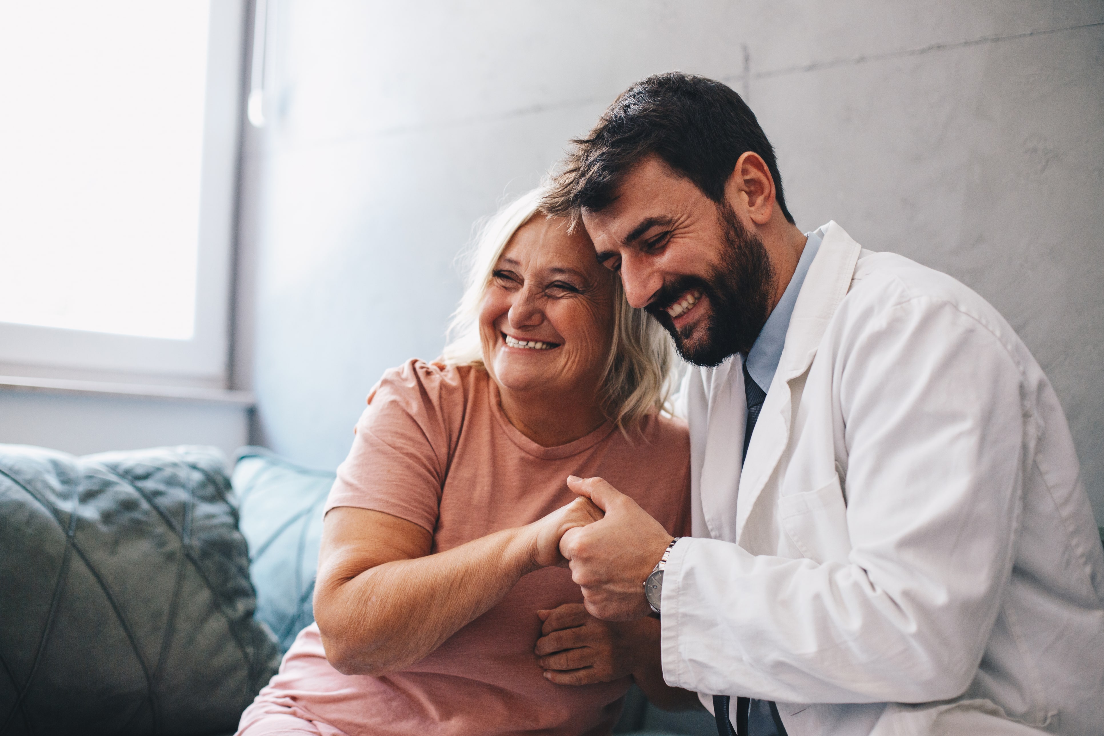 happy patient talking with doctor