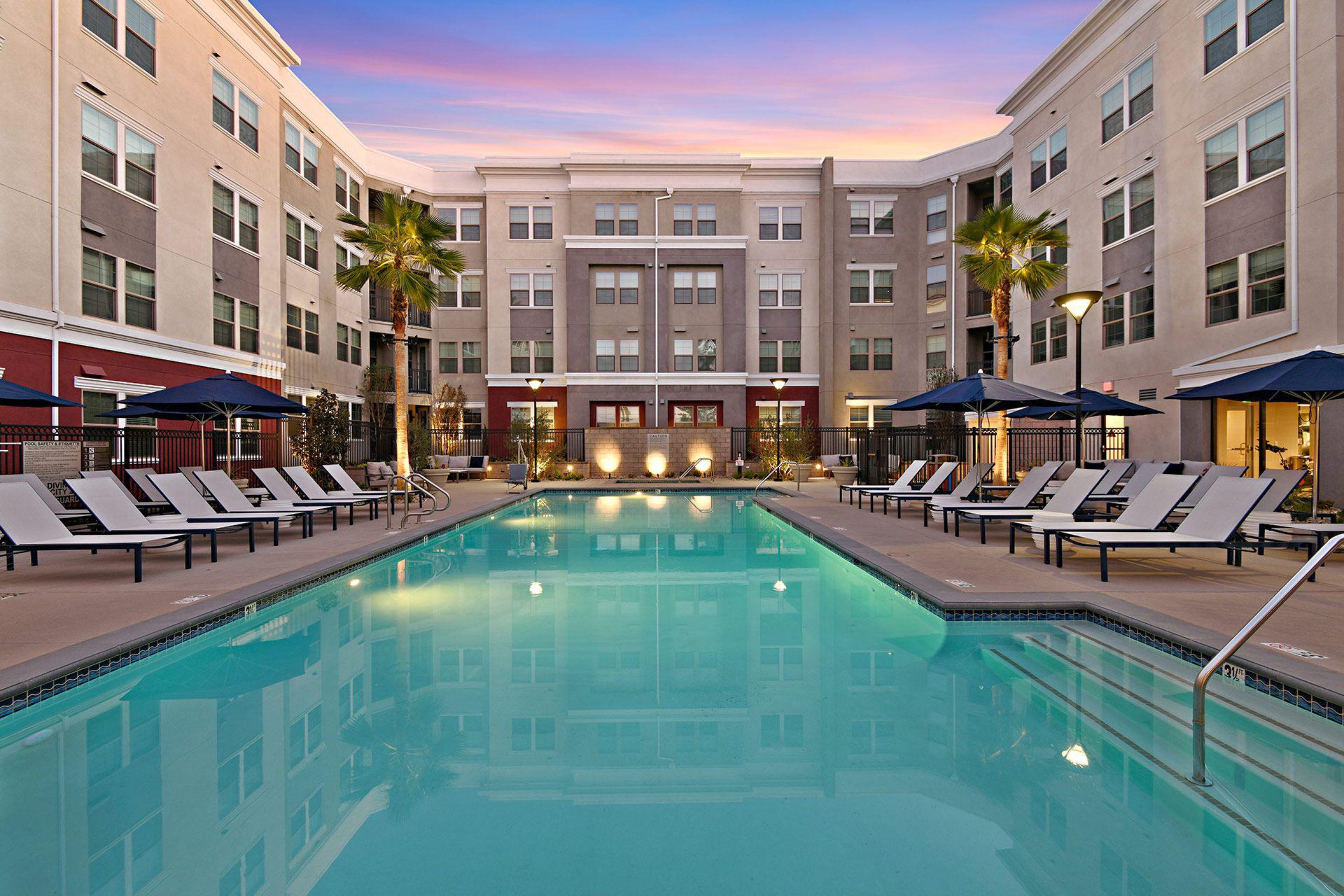 Resort-style swimming pool at The Huntington luxury apartments in Duarte, CA.