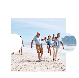 A multigenerational family playing on the beach.