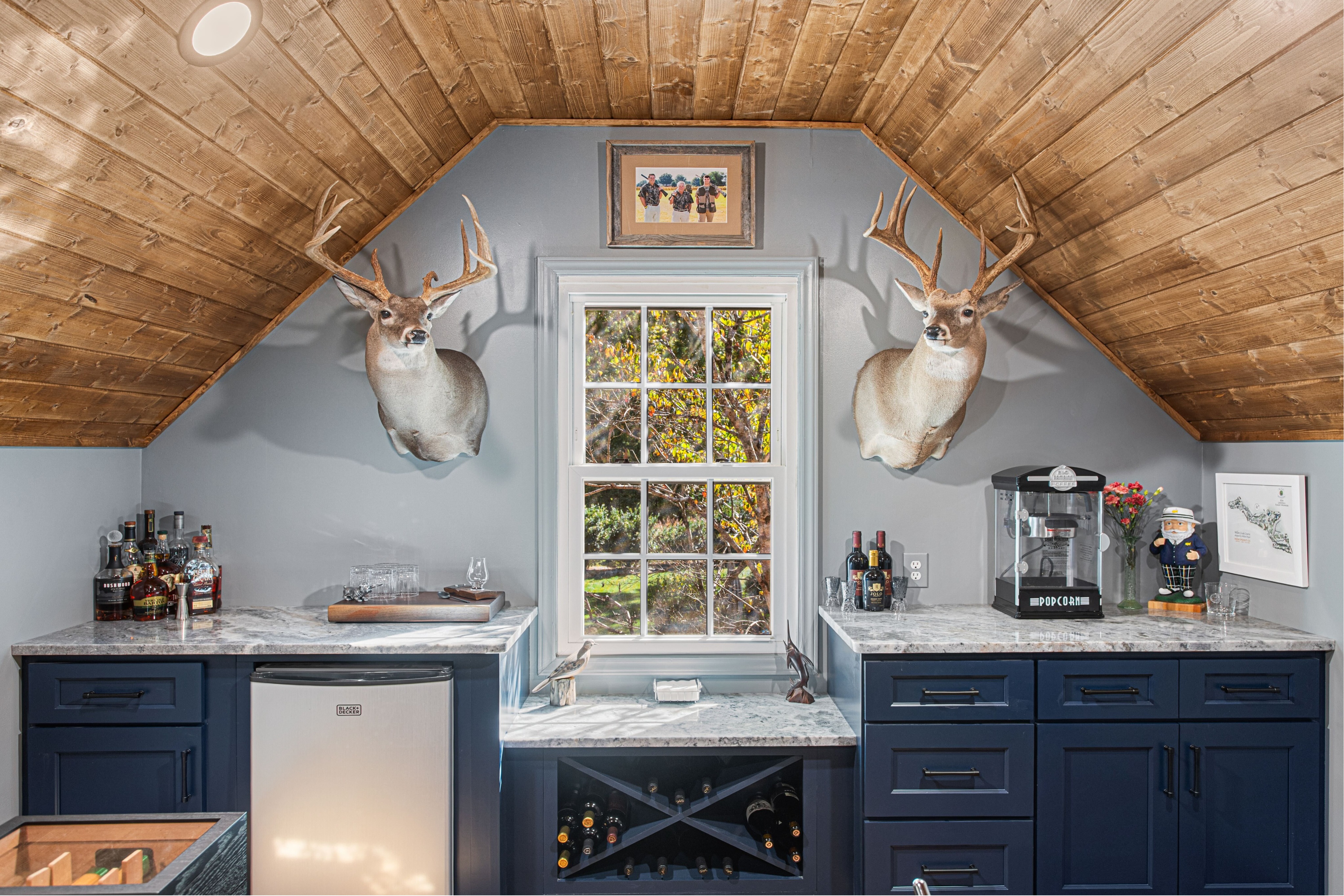 Custom built-in cabinetry and wood ceiling interior renovation near Badin Lake, North Carolina. This finished space demonstrates high-end craftsmanship, custom carpentry, and attention to detail in residential remodeling.