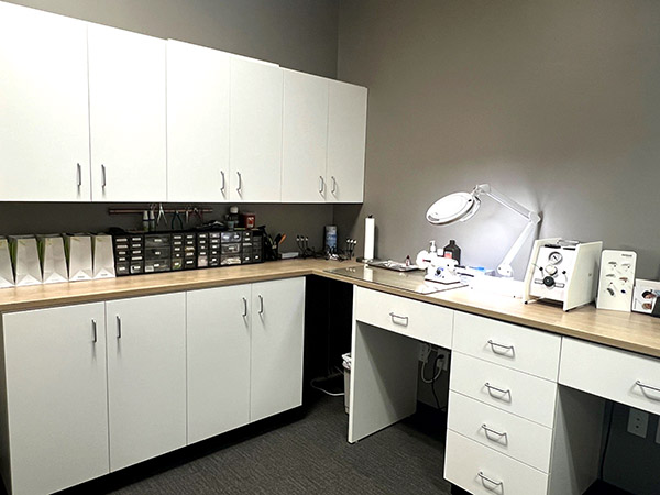 Interior photo of the hearing aid lab for AudioNova hearing clinic in Leesburg, FL