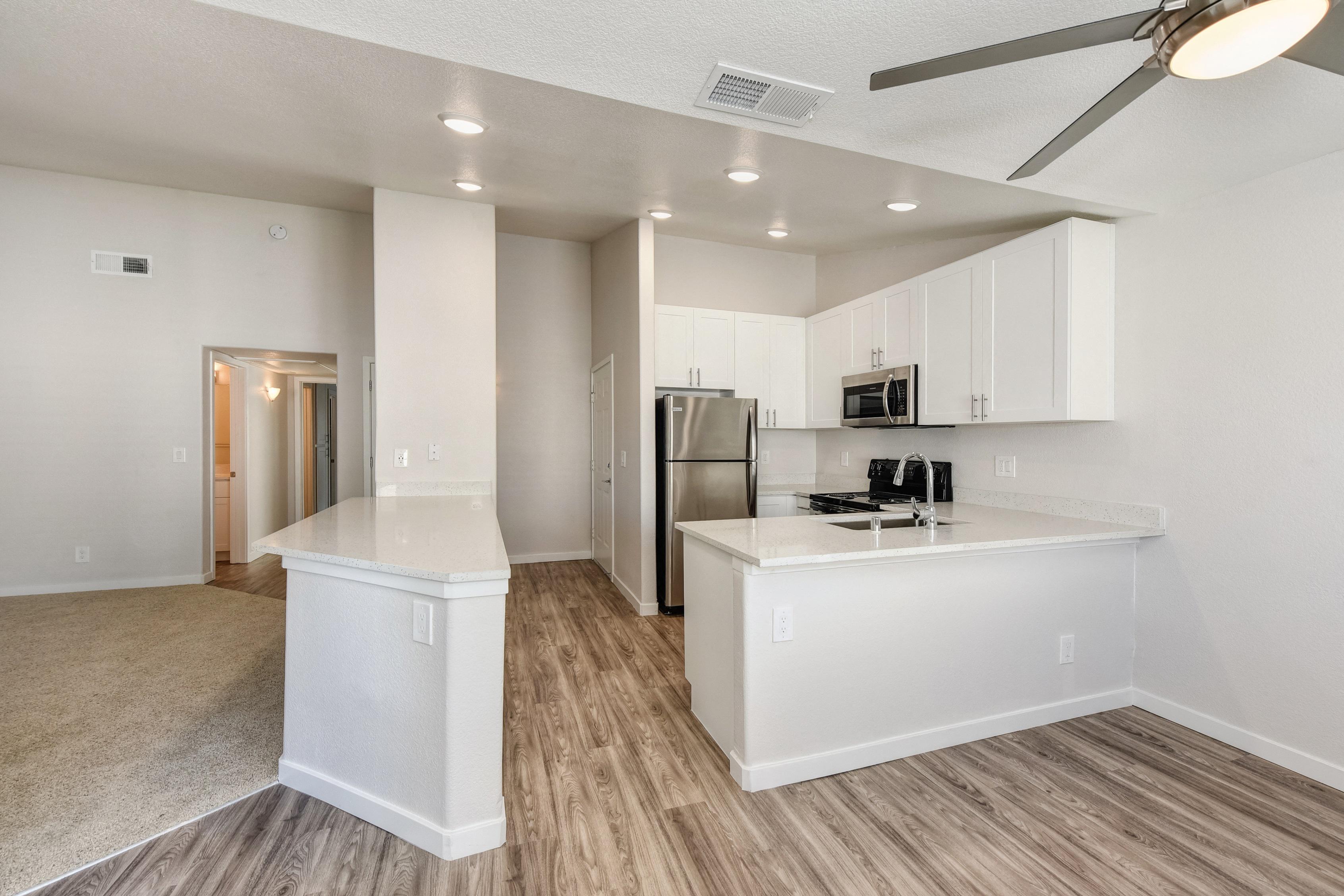 Kitchen with View of Entryway at The Legacy Apartments