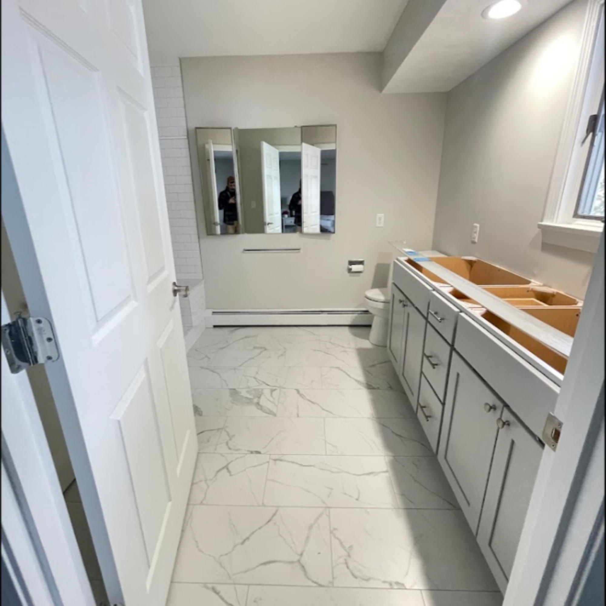 Luxurious bathroom vanity setup with double sinks, elegant cabinetry, and a bright, modern design. A perfect combination of style and practicality.