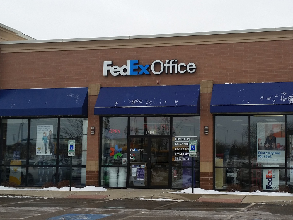 Exterior photo of FedEx Office location at 1494 S Randall Rd\t Print quickly and easily in the self-service area at the FedEx Office location 1494 S Randall Rd from email, USB, or the cloud\t FedEx Office Print & Go near 1494 S Randall Rd\t Shipping boxes and packing services available at FedEx Office 1494 S Randall Rd\t Get banners, signs, posters and prints at FedEx Office 1494 S Randall Rd\t Full service printing and packing at FedEx Office 1494 S Randall Rd\t Drop off FedEx packages near 1494 S Randall Rd\t FedEx shipping near 1494 S Randall Rd