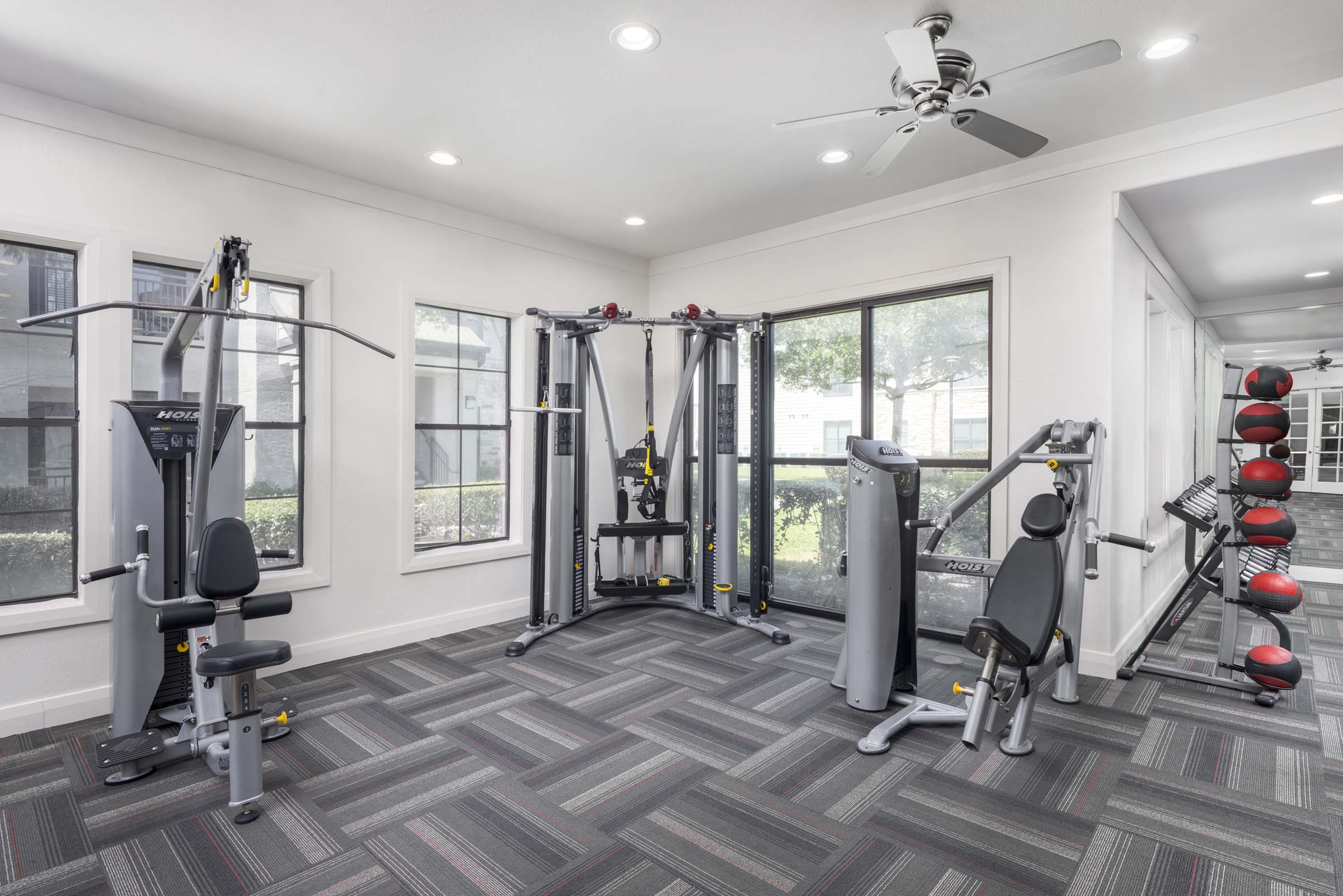 Fitness Center featuring functional trainer, LAT pulldown machine and multi-press machine