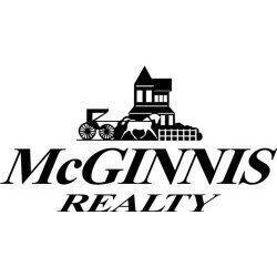 Julie Wynn | McGinnis Realty & Appraisals Logo