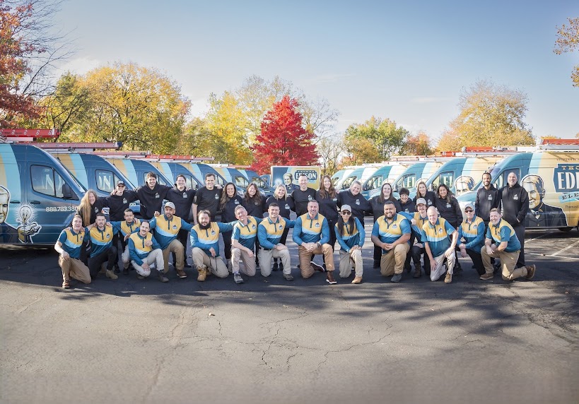 Full Thomas Edison Electric team gathered with service vehicles, representing residential and commercial electrical services throughout Pennsylvania