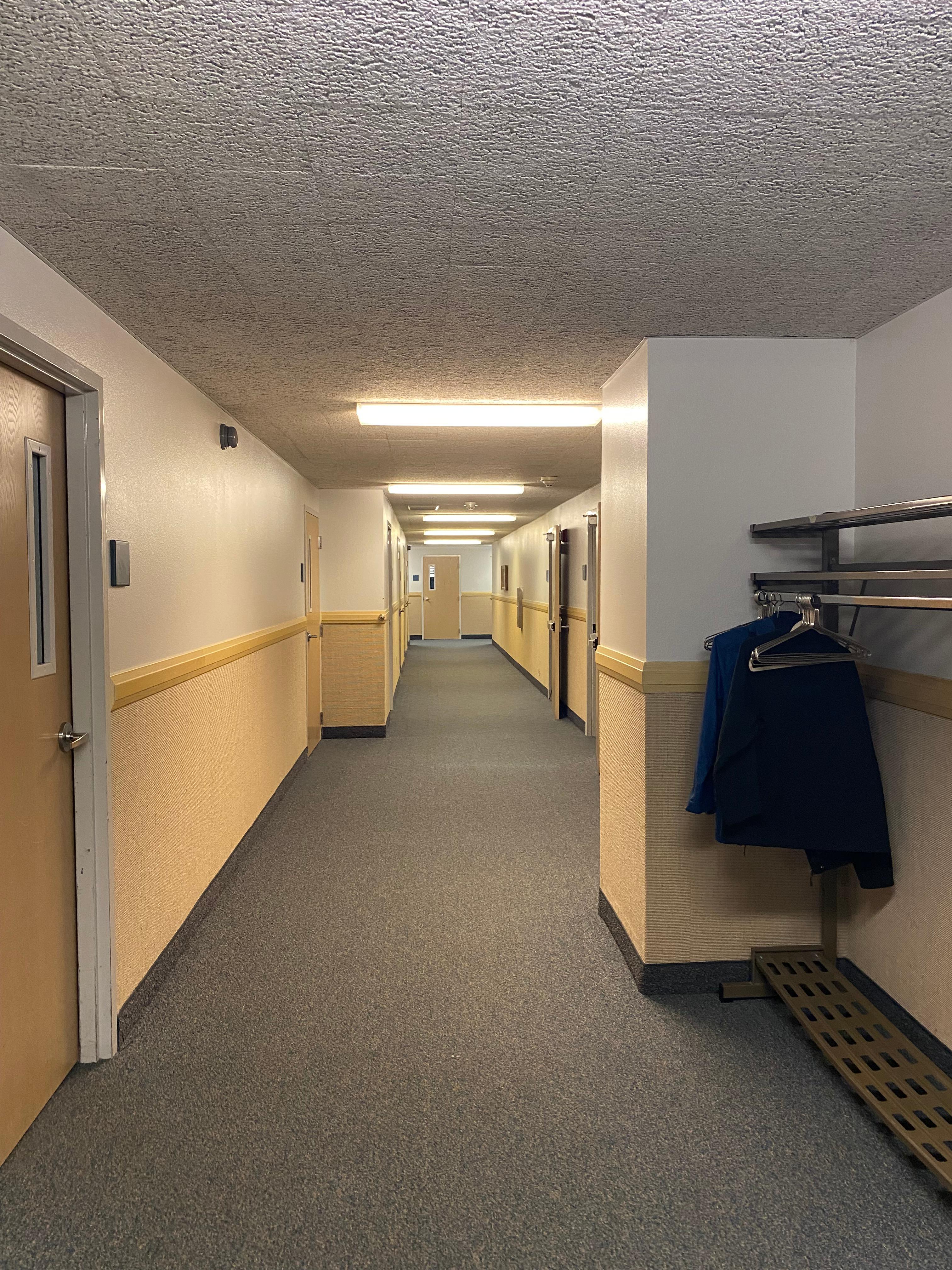 A hallway leading to classrooms, bathrooms, etc.