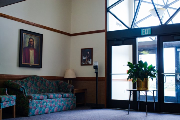 The foyer of The Church of Jesus Christ of Latter-day Saints buildings serves as a transitional space between the exterior and the interior worship areas. It is designed to be a welcoming and functional area that facilitates community interaction and sets the tone for the spiritual experience within the chapel.