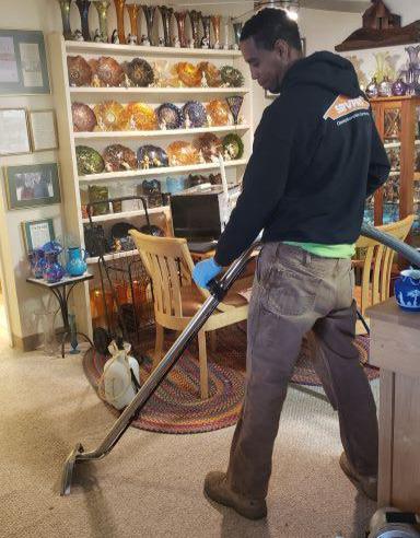 Ramon Cleaning a Carpet.